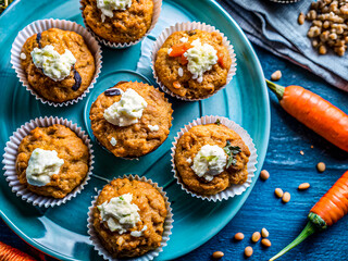 Tasty vegan carrot muffins with ricotta cheese. Delicious food background