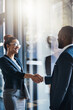 © peopleimages.com - Happy, business and people with handshake in office for welcome, introduction and company partnership. Employees, thank you and congratulations, promotion and negotiation deal for proposal agreement