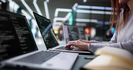 Wall Mural - professional woman coding software on office computer