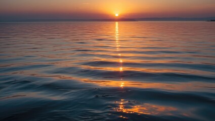 Aufkleber - Sunset Reflection on Calm Water Surface with Gentle Waves and Orange Sky Over Horizon