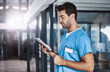 © peopleimages.com - Health nurse, man and tablet in hospital for healthcare records, medical research and online results. Night, male professional and digital tech for surgery schedule, telehealth and overtime workflow