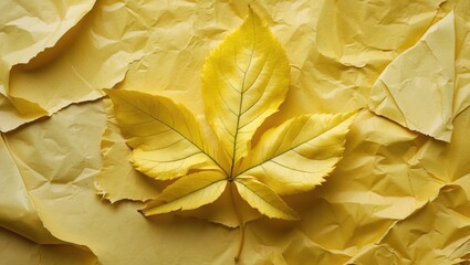 Poster - Yellow leaf on crumpled yellow paper background highlighting texture and color contrast in a minimalist composition
