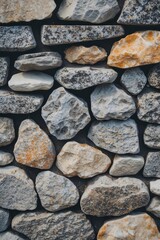 Poster - textured wall composed of various shaped and colored stones in natural setting