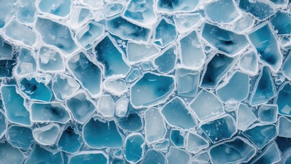 Wall Mural - Blue ice texture with jagged pieces and varying transparent shades of blue and white forming an abstract pattern.