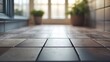 © Seyyar - Indoor perspective of a stylish tiled floor with natural light illuminating the space and greenery in the background creating a serene atmosphere.