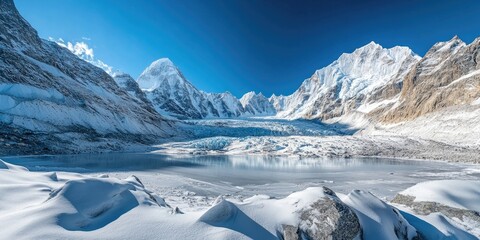 Aufkleber - Panoramic view of a snow-covered glacier with turquoise lake under clear blue sky featuring rugged mountains and serene white landscapes