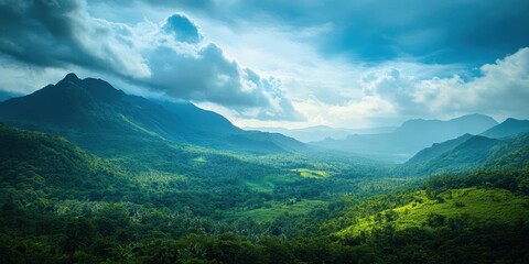 Leinwandbilder - Majestic green mountains stretch across the image with lush valleys below under a dramatic blue sky filled with soft white clouds in a serene landscape.