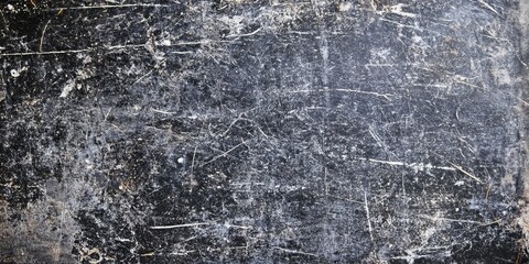 Poster - Scratched dark linoleum wall texture with deep grooves and weathered surface showing a blend of black and grey tones for dramatic background use