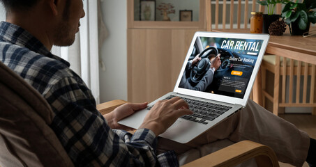 Wall Mural - car rental website on computer screen for tourist to rent a car for transportation snugly