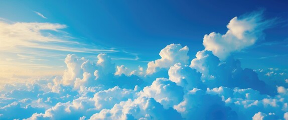 Wall Mural - clouds in blue sky at daytime with white fluffy clouds and soft sunlight illuminating the scene for 