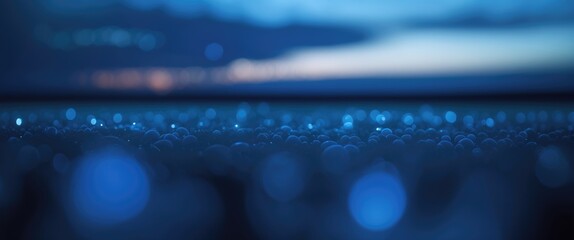 Wall Mural - blue abstract background with soft bokeh light patterns and water droplets creating a dreamy or tran