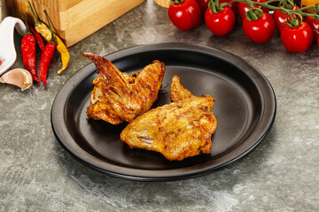 Wall Mural - Tasty roasted chicken wing with spices