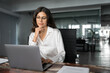 © Stock 4 You - Focused professional financial it specialist latin hispanic business lady working concentrated on laptop pc sitting in office. Middle eastern indian woman using computer technology app for work online