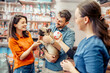 © ivanko80 - Couple enjoys shopping for their puppy at a pet store while interacting with an employee