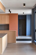 © Chari - Modern interior design showcasing open kitchen and color block wall in contemporary space