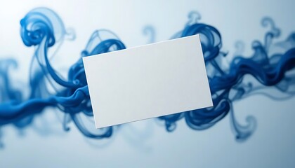 White business card mockup centered against swirling blue ink in water, creating a striking contrast, ideal for showcasing branding or contact information