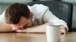 © Photock Agency - Person Experiencing Work Stress with Empty Coffee Cup on Desk in Modern Office Environment