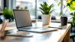 © Generative AI - Modern laptop on a wooden desk surrounded by greenery in a bright and inviting workspace : Generative AI