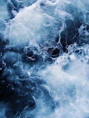 Leinwandbilder - Dynamic closeup of ocean waves with frothy white bubbles contrasting dark water : Generative AI