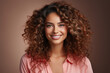 © BloomPix - Close-up portrait of smiling brunette girl with curly hair. Ideal for beauty salon