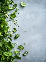 Poster - Fresh Green Spinach Leaves Scattered on a Gray Background for Healthy Cooking and Nutrition : Generative AI