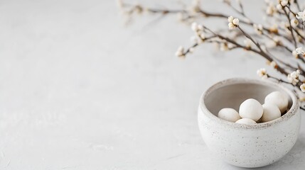 Leinwandbilder - Elegant white ceramic bowl filled with small round decorative stones surrounded by delicate flowers on a light surface : Generative AI