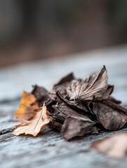 Leinwandbilder - Closeup of dried leaves in shades of brown and yellow scattered on a rustic wooden surface : Generative AI