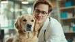 © BROTHER - Young caucasian male vet smiling with golden retriever in veterinary clinic