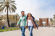 © oneinchpunch - Beautiful hispanic young couple dating outdoors and visiting European city's landmarks - Tourists having fun on travel vacation