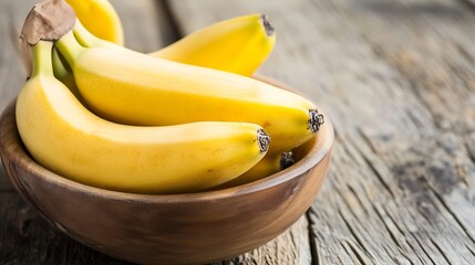 Aufkleber - Freshly harvested bananas arranged neatly in a rustic wooden bowl on a textured table surface : Generative AI