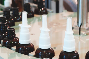 Poster - pharmaceutical industry, medicine pills are filling in the  bottle on production line machine conveyor at the medical factory. selective focus.