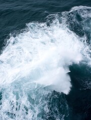 Leinwandbilder - Aerial view of ocean water creating foam and waves in a dynamic splash with rich blue tones : Generative AI