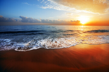 Wall Mural - beautiful sandy beach and sea a sunset time