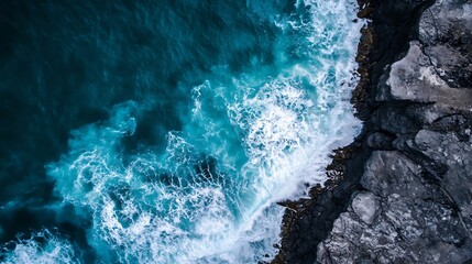 Leinwandbilder - Aerial view of dynamic ocean waves crashing against rocky shore under bright sunlight : Generative AI