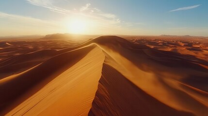 Wall Mural - Dramatic Desert Landscape at Golden Hour with Rolling Sand Dunes and Pristine Sky Creating Natural Abstract Patterns