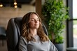 © Sergio Lucci - Relaxation and wellness at work: woman enjoying a company provided massage therapy session