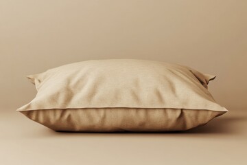 Wall Mural - A square beige colored pillow resting on a surface