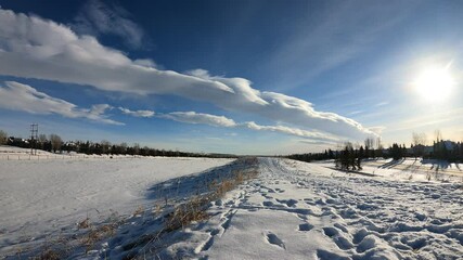 Wall Mural - time-lapse blue sky, cloudscape background. white fluffy clouds generate above winter time. wide-ang