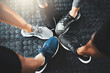 © peopleimages.com - Fitness, group or huddle with shoes in circle for teamwork, workout or unity at indoor health club. Top view, closeup or active people with feet or sneakers for motivation or exercise together at gym