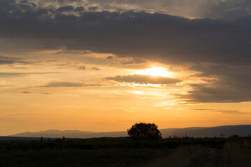 Wall Mural - Sunset over the Balkans. The stillness and the dusk. Cirrus clouds in a crimson sky.