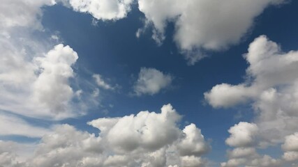 Wall Mural - time-lapse blue sky, cloudscape background. white fluffy clouds generate powerful energy and environ