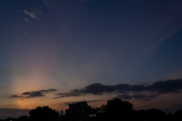 Wall Mural - beautiful sunset over the city. silhouette of a building.