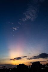 Wall Mural - beautiful sunset over the city. silhouette of a building.