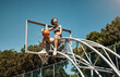 © peopleimages.com - Basketball, sports and woman on net on court outdoor at park for match, competition and game. Blue sky, thinking and person on hoop for goal, score and practice in training, fitness and exercise