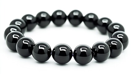 Poster - Close-up of a glossy black obsidian bead bracelet on a clean surface : Generative AI