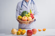© R Photography - A male doctor stands holding an apple against a white background, promoting healthy eating educates patients on nutrition, wellness, disease prevention through a balanced diet and medical expertise