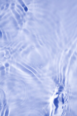 Wall Mural - Calm Blue Water Surface with Gentle Ripples and Reflections