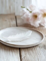 Aufkleber - Delicate white feather elegantly placed on a wooden plate surrounded by flowers : Generative AI