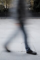 Fototapete - Blurred Motion of a Walking Person Depicting Urban Life in a Busy City Street : Generative AI