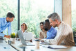 © ty - Business team discussing together business plans in office.